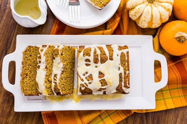 Libby’s Pumpkin Roll Recipe: A Classic Fall Dessert
"Libby’s Pumpkin Roll Recipe:

When the leaves start to turn and the crisp air fills with the aroma of pumpkin spice, there’s no better treat than Libby’s Pumpkin Roll Recipe This delightful dessert is a fall favorite, combining the warm flavors of pumpkin and spices with a creamy cream cheese filling. Not only is it a crowd-pleaser, but it’s also surprisingly easy to make with the right tips and techniques. Whether you're looking to create a show-stopping dessert for Thanksgiving or just want a comforting treat on a chilly fall day, this recipe will be a hit.

Ingredients for Libby’s Pumpkin Roll Recipe

To make this iconic recipe, you’ll need the following ingredients:

For the Cake:

3/4 cup all-purpose flour
1/2 teaspoon baking powder
1/2 teaspoon baking soda
1/2 teaspoon ground cinnamon
1/2 teaspoon ground nutmeg
1/4 teaspoon ground cloves
1/4 teaspoon salt
3 large eggs
1 cup granulated sugar
2/3 cup Libby’s 100% Pure Pumpkin (for that rich pumpkin flavor)

For the Filling:

1 package (8 ounces) cream cheese, softened
1 cup powdered sugar, sifted
6 tablespoons butter, softened
1 teaspoon vanilla extract

Learn more about Libby’s authentic ingredients and their benefits.

How to Make Libby’s Pumpkin Roll Rrcipe

Follow these steps for the perfect Libby’s Pumpkin Roll Recipe:

Prepare the Pan:
Preheat your oven to 375°F (190°C).
Line a 15x10-inch jelly-roll pan with parchment paper and grease it lightly.
Mix Dry Ingredients:
Combine flour, baking powder, baking soda, cinnamon, nutmeg, cloves, and salt in a small bowl. This ensures your spices are evenly distributed throughout the cake.
Create the Batter:
Beat eggs and sugar in a large mixing bowl until thick and pale, about 2 minutes.
Stir in Libby’s Pure Pumpkin.
Gently fold in the dry ingredients using a spatula, mixing just until combined. Be careful not to overmix, as this can affect the texture of your cake.
Bake the Cake:
Spread the batter evenly in the prepared pan.
Bake for 13-15 minutes or until the top springs back when lightly touched. It should have a slight golden color.
Tip: Don’t overbake the cake; it should remain soft enough to roll without cracking.
Roll the Cake:
While the cake is still hot, carefully roll it in a clean, lint-free towel dusted with powdered sugar. This helps the cake keep its shape while cooling.
Let it cool completely in the towel. This is a crucial step, as it prevents the cake from breaking when you unroll it later.
Prepare the Filling:
In a separate bowl, beat cream cheese, powdered sugar, butter, and vanilla extract until smooth and creamy. Make sure there are no lumps.
Unroll the cooled cake and spread the cream cheese filling evenly over the surface.
Re-Roll and Chill:
Carefully re-roll the cake without the towel.
Wrap in plastic wrap and refrigerate for at least one hour before serving. Chilling helps the roll set, making it easier to slice.

Discover additional tips for rolling and baking pumpkin rolls.

Tips for a Perfect Libby’s Pumpkin Roll Recipe
Prevention of Cracking: Ensure your cake is rolled while warm to prevent cracks. If your cake does crack slightly, don’t panic—just patch it with a little extra filling when you re-roll it.
Powdered Sugar on the Towel: Use a generous amount of powdered sugar on the towel when rolling the cake. This helps prevent the cake from sticking and makes it easier to unroll when you fill it.
Cool Completely: Be sure to let the cake cool completely before unrolling it. Otherwise, the filling may melt, and the cake may become too soft to roll properly.
Refrigerate Before Slicing: Refrigerating the pumpkin roll before slicing helps the cake hold its shape and results in clean, professional-looking slices.
Variations to Try

Looking to put your own spin on this recipe? Here are some creative variations:

Nuts for Crunch: Add chopped nuts, like pecans or walnuts, to the batter for extra texture and flavor. These will add a satisfying crunch to the soft cake and creamy filling.
Top with Extras: Sprinkle powdered sugar on top of the roll after refrigerating for a simple touch. Alternatively, drizzle caramel sauce or melted chocolate for a festive twist.
Buttercream Filling: Substitute the cream cheese filling with a spiced buttercream for a richer, sweeter option. This is a great choice for those who prefer a less tangy filling.
Mini Rolls: Instead of making one large roll, create smaller, individual pumpkin rolls. This is a fun and portion-controlled way to serve this delicious treat at parties or gatherings.
Storage and Make-Ahead Tips
Storing the Roll: Store the pumpkin roll in an airtight container in the refrigerator for up to 5 days. The flavors will continue to develop, making it even tastier the next day.
Freezing for Later: You can freeze the pumpkin roll for up to 3 months. Simply wrap it tightly in plastic wrap and foil before freezing. Thaw it in the fridge overnight before serving.
FAQs About Libby’s Pumpkin Roll Recipe
Can I use fresh pumpkin instead of canned?
Yes! You can use fresh pumpkin puree instead of Libby’s 100% Pure Pumpkin. However, make sure the pumpkin is well-drained and pureed to match the consistency of canned pumpkin.
How do I prevent the cake from sticking to the towel?
Dust the towel generously with powdered sugar before rolling the cake. This prevents it from sticking and helps the cake maintain its shape.
Can I make the pumpkin roll ahead of time?
Absolutely! The pumpkin roll can be made ahead of time and stored in the refrigerator for 1-2 days. This also helps the flavors meld together.
What should I do if my cake cracks while rolling?
If your cake cracks, don’t worry. Just patch the crack with a little extra filling when you re-roll the cake. The filling will help seal any cracks and keep the roll intact.
How long can the pumpkin roll be stored in the freezer?
You can freeze the pumpkin roll for up to 3 months. Make sure to wrap it tightly in plastic wrap and foil to protect it from freezer burn.
[Explore this delicious carrot juice recipe: easy steps and health benefits that can be served with Libby's pumpkin roll recipe:](https://recipesflavornatural.com/fall-desserts/)!

A Dessert Worth Sharing

With its rich, spiced flavor and creamy filling,Libby’s Pumpkin Roll Recipe is the perfect dessert for any fall occasion. Whether you’re hosting a holiday gathering or simply indulging in a seasonal treat, this recipe is sure to impress. Give it a try, and let the warm, comforting flavors of pumpkin spice fill your home.