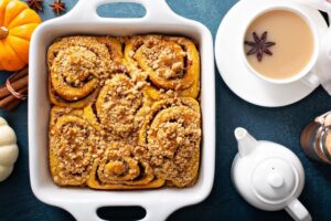 Libby’s Pumpkin Roll Recipe: A Classic Fall Dessert
"Libby’s Pumpkin Roll Recipe:

When the leaves start to turn and the crisp air fills with the aroma of pumpkin spice, there’s no better treat than Libby’s Pumpkin Roll Recipe This delightful dessert is a fall favorite, combining the warm flavors of pumpkin and spices with a creamy cream cheese filling. Not only is it a crowd-pleaser, but it’s also surprisingly easy to make with the right tips and techniques. Whether you're looking to create a show-stopping dessert for Thanksgiving or just want a comforting treat on a chilly fall day, this recipe will be a hit.

Ingredients for Libby’s Pumpkin Roll Recipe

To make this iconic recipe, you’ll need the following ingredients:

For the Cake:

3/4 cup all-purpose flour
1/2 teaspoon baking powder
1/2 teaspoon baking soda
1/2 teaspoon ground cinnamon
1/2 teaspoon ground nutmeg
1/4 teaspoon ground cloves
1/4 teaspoon salt
3 large eggs
1 cup granulated sugar
2/3 cup Libby’s 100% Pure Pumpkin (for that rich pumpkin flavor)

For the Filling:

1 package (8 ounces) cream cheese, softened
1 cup powdered sugar, sifted
6 tablespoons butter, softened
1 teaspoon vanilla extract

Learn more about Libby’s authentic ingredients and their benefits.

How to Make Libby’s Pumpkin Roll Rrcipe

Follow these steps for the perfect Libby’s Pumpkin Roll Recipe:

Prepare the Pan:
Preheat your oven to 375°F (190°C).
Line a 15x10-inch jelly-roll pan with parchment paper and grease it lightly.
Mix Dry Ingredients:
Combine flour, baking powder, baking soda, cinnamon, nutmeg, cloves, and salt in a small bowl. This ensures your spices are evenly distributed throughout the cake.
Create the Batter:
Beat eggs and sugar in a large mixing bowl until thick and pale, about 2 minutes.
Stir in Libby’s Pure Pumpkin.
Gently fold in the dry ingredients using a spatula, mixing just until combined. Be careful not to overmix, as this can affect the texture of your cake.
Bake the Cake:
Spread the batter evenly in the prepared pan.
Bake for 13-15 minutes or until the top springs back when lightly touched. It should have a slight golden color.
Tip: Don’t overbake the cake; it should remain soft enough to roll without cracking.
Roll the Cake:
While the cake is still hot, carefully roll it in a clean, lint-free towel dusted with powdered sugar. This helps the cake keep its shape while cooling.
Let it cool completely in the towel. This is a crucial step, as it prevents the cake from breaking when you unroll it later.
Prepare the Filling:
In a separate bowl, beat cream cheese, powdered sugar, butter, and vanilla extract until smooth and creamy. Make sure there are no lumps.
Unroll the cooled cake and spread the cream cheese filling evenly over the surface.
Re-Roll and Chill:
Carefully re-roll the cake without the towel.
Wrap in plastic wrap and refrigerate for at least one hour before serving. Chilling helps the roll set, making it easier to slice.

Discover additional tips for rolling and baking pumpkin rolls.

Tips for a Perfect Libby’s Pumpkin Roll Recipe
Prevention of Cracking: Ensure your cake is rolled while warm to prevent cracks. If your cake does crack slightly, don’t panic—just patch it with a little extra filling when you re-roll it.
Powdered Sugar on the Towel: Use a generous amount of powdered sugar on the towel when rolling the cake. This helps prevent the cake from sticking and makes it easier to unroll when you fill it.
Cool Completely: Be sure to let the cake cool completely before unrolling it. Otherwise, the filling may melt, and the cake may become too soft to roll properly.
Refrigerate Before Slicing: Refrigerating the pumpkin roll before slicing helps the cake hold its shape and results in clean, professional-looking slices.
Variations to Try

Looking to put your own spin on this recipe? Here are some creative variations:

Nuts for Crunch: Add chopped nuts, like pecans or walnuts, to the batter for extra texture and flavor. These will add a satisfying crunch to the soft cake and creamy filling.
Top with Extras: Sprinkle powdered sugar on top of the roll after refrigerating for a simple touch. Alternatively, drizzle caramel sauce or melted chocolate for a festive twist.
Buttercream Filling: Substitute the cream cheese filling with a spiced buttercream for a richer, sweeter option. This is a great choice for those who prefer a less tangy filling.
Mini Rolls: Instead of making one large roll, create smaller, individual pumpkin rolls. This is a fun and portion-controlled way to serve this delicious treat at parties or gatherings.
Storage and Make-Ahead Tips
Storing the Roll: Store the pumpkin roll in an airtight container in the refrigerator for up to 5 days. The flavors will continue to develop, making it even tastier the next day.
Freezing for Later: You can freeze the pumpkin roll for up to 3 months. Simply wrap it tightly in plastic wrap and foil before freezing. Thaw it in the fridge overnight before serving.
FAQs About Libby’s Pumpkin Roll Recipe
Can I use fresh pumpkin instead of canned?
Yes! You can use fresh pumpkin puree instead of Libby’s 100% Pure Pumpkin. However, make sure the pumpkin is well-drained and pureed to match the consistency of canned pumpkin.
How do I prevent the cake from sticking to the towel?
Dust the towel generously with powdered sugar before rolling the cake. This prevents it from sticking and helps the cake maintain its shape.
Can I make the pumpkin roll ahead of time?
Absolutely! The pumpkin roll can be made ahead of time and stored in the refrigerator for 1-2 days. This also helps the flavors meld together.
What should I do if my cake cracks while rolling?
If your cake cracks, don’t worry. Just patch the crack with a little extra filling when you re-roll the cake. The filling will help seal any cracks and keep the roll intact.
How long can the pumpkin roll be stored in the freezer?
You can freeze the pumpkin roll for up to 3 months. Make sure to wrap it tightly in plastic wrap and foil to protect it from freezer burn.
[Explore this delicious carrot juice recipe: easy steps and health benefits that can be served with Libby's pumpkin roll recipe:](https://recipesflavornatural.com/fall-desserts/)!

A Dessert Worth Sharing

With its rich, spiced flavor and creamy filling,Libby’s Pumpkin Roll Recipe is the perfect dessert for any fall occasion. Whether you’re hosting a holiday gathering or simply indulging in a seasonal treat, this recipe is sure to impress. Give it a try, and let the warm, comforting flavors of pumpkin spice fill your home.